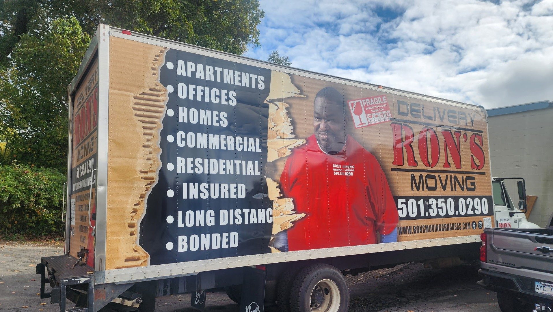 Ron's Delivery & Moving branded truck with owner Ron Smith